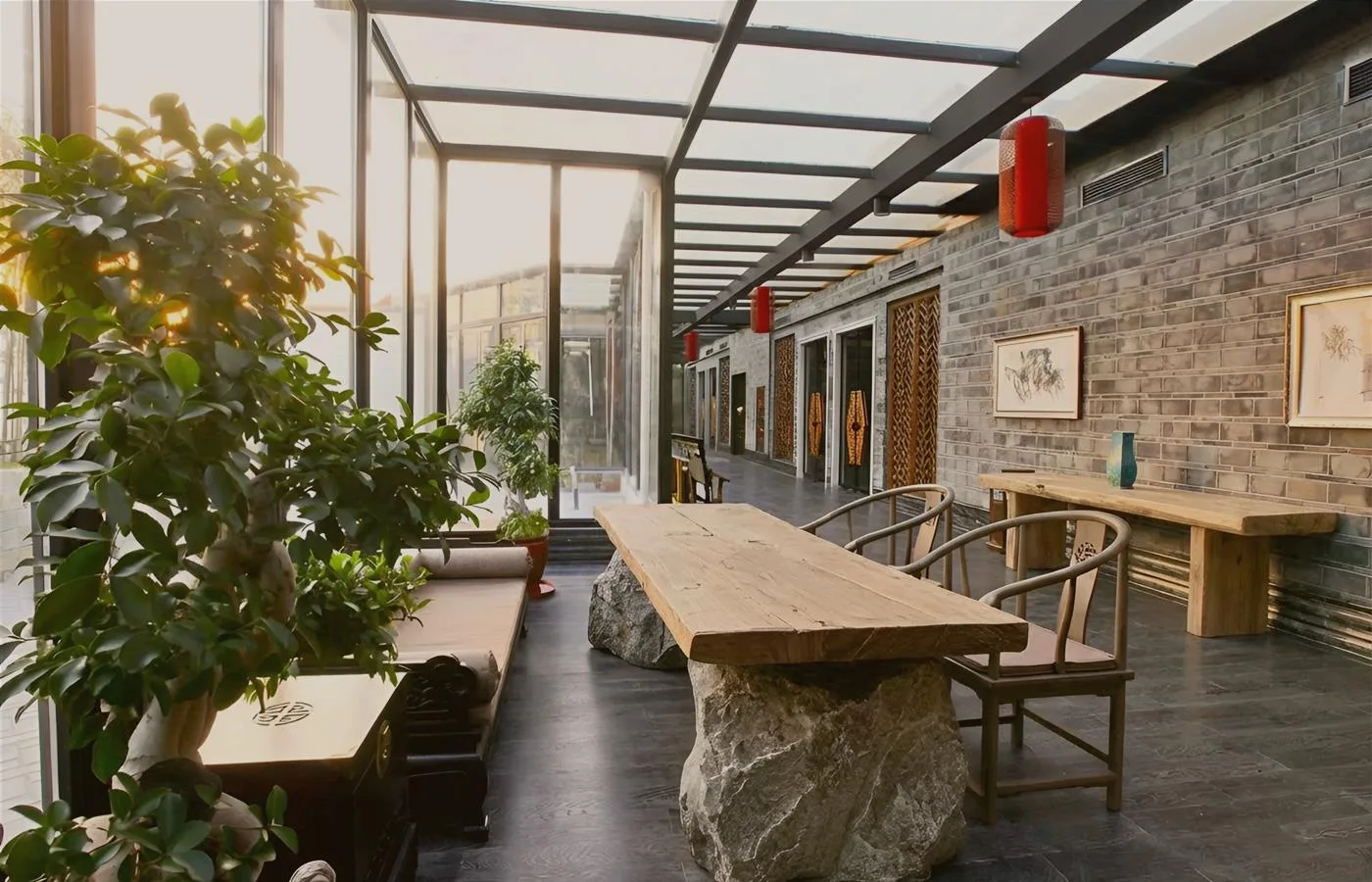 tea room sunroom with a wood tea table plants and warm daylight